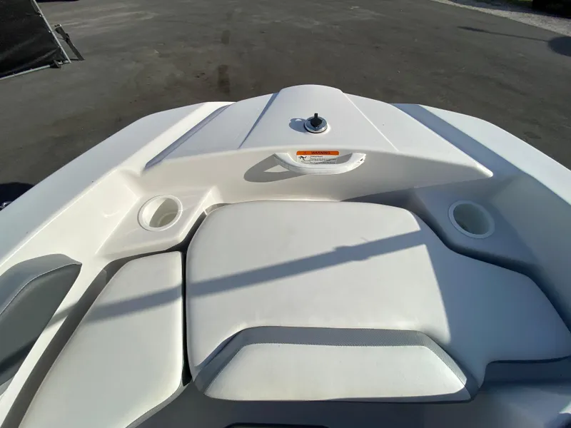 Slide: The Image of 2018 Scarab 165 G boat interior with white seating and cup holders. - 15