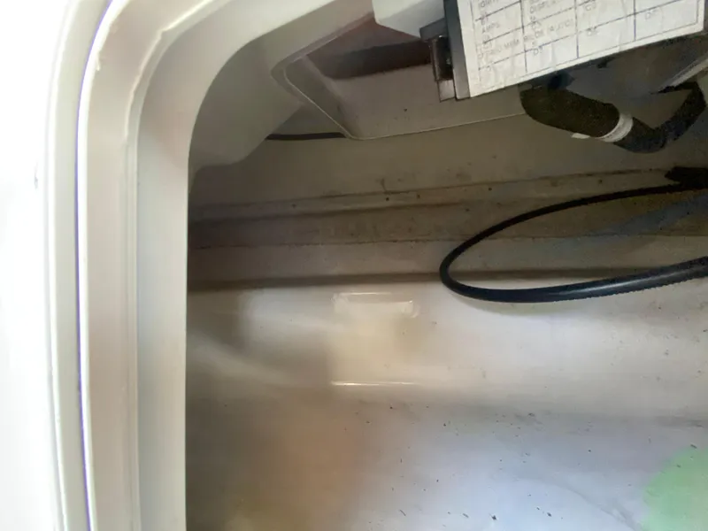 Slide: The Image of Interior view of a 2018 Scarab 165 G boat compartment. - 19
