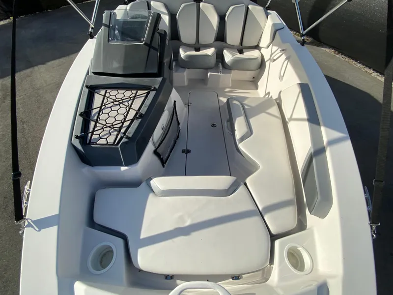 Slide: The Image of 2018 Scarab 165 G boat interior with seating and storage compartments. - 22