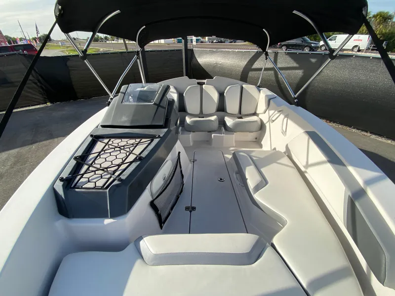 Slide: The Image of 2018 Scarab 165 G boat interior with seating and canopy. - 23