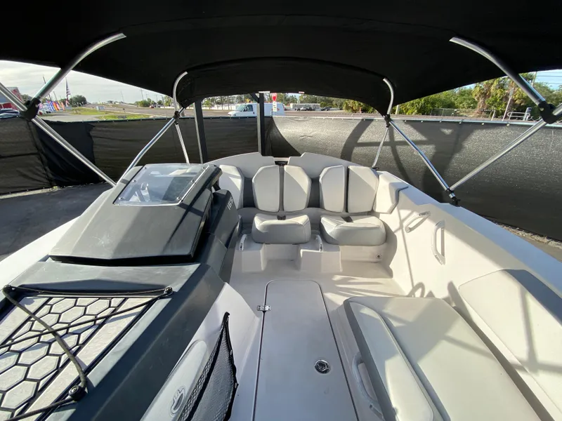 Slide: The Image of 2018 Scarab 165 G boat interior with seating and canopy. - 24