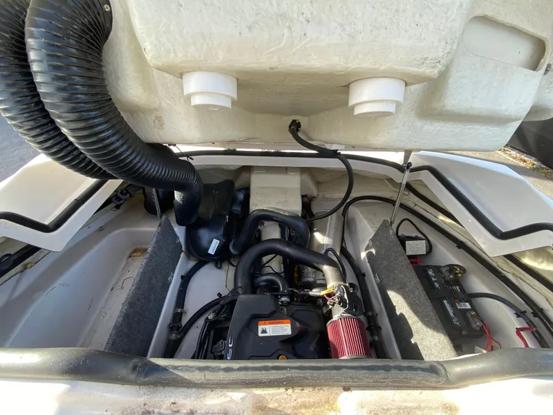 Slide: The Image of 2018 Scarab 165 G engine compartment with visible components and wiring. - 26