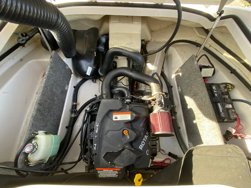 Slide: The Image of Engine compartment of 2018 Scarab 165 G boat with Rotax engine and components. - 27