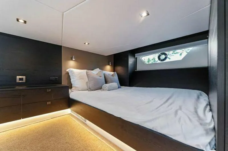 Slide: The Image of Luxurious bedroom interior of 2021 Vanquish VQ58 yacht with modern design and ambient lighting. - 24
