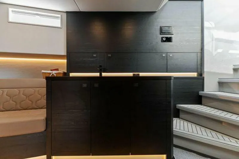 Slide: The Image of Luxurious interior of 2021 Vanquish VQ58 yacht with modern cabinetry and seating. - 27