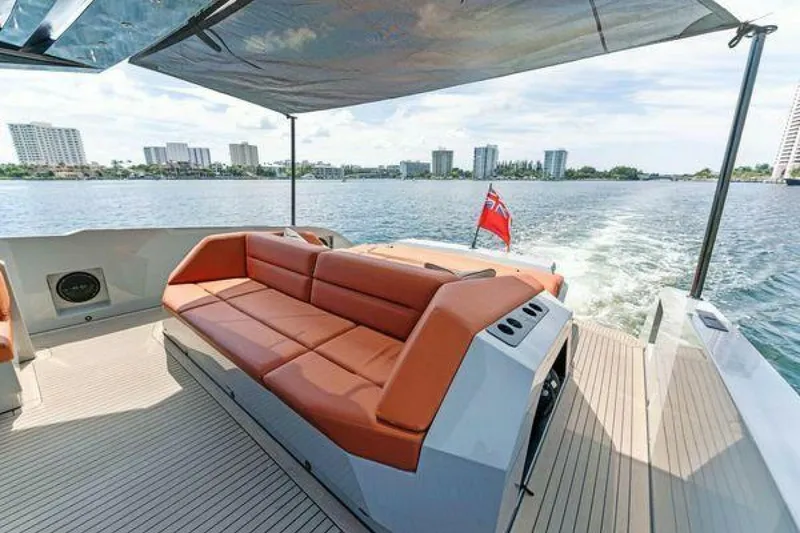 Slide: The Image of Luxurious 2021 Vanquish VQ58 yacht with spacious deck and seating, cruising on a sunny day. - 30