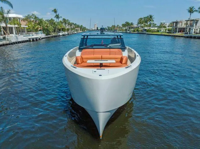 Slide: The Image of 2021 Vanquish VQ58 luxury yacht cruising on a scenic waterway. - 40