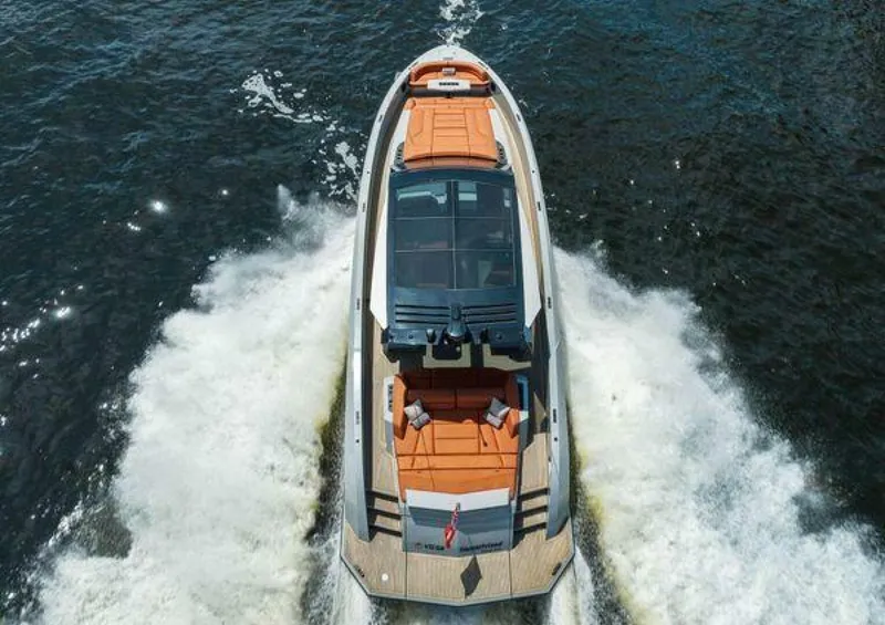 Slide: The Image of Vanquish VQ58 2021 luxury yacht cruising on open water, aerial view. - 45
