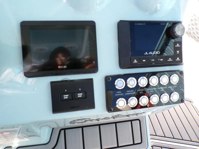 Slide: The Image of Control panel of 2025 Tidewater 2700 CB boat with Yamaha and JL Audio systems. - 15