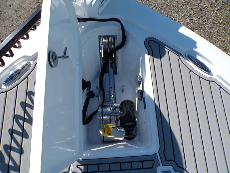 Slide: The Image of Anchor compartment of 2025 Tidewater 2700 CB boat with gray decking. - 18