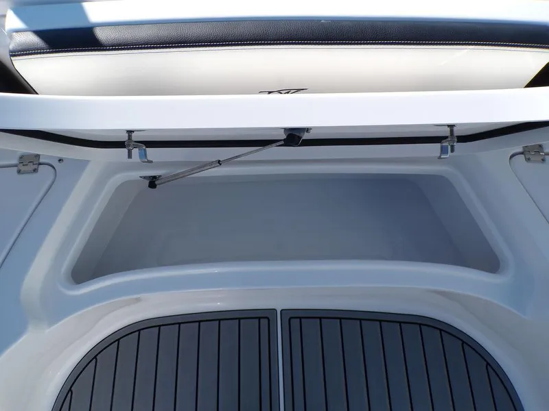 Slide: The Image of 2025 Tidewater 2700 CB boat storage compartment with open lid. - 22