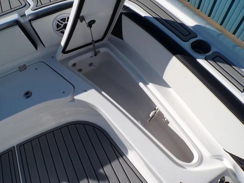 Slide: The Image of 2025 Tidewater 2700 CB boat interior with storage compartments and sleek design. - 23