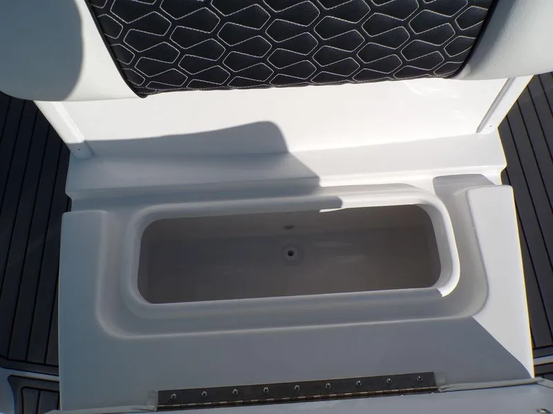 Slide: The Image of Tidewater 2700 CB 2025 boat storage compartment with cushioned seating. - 26
