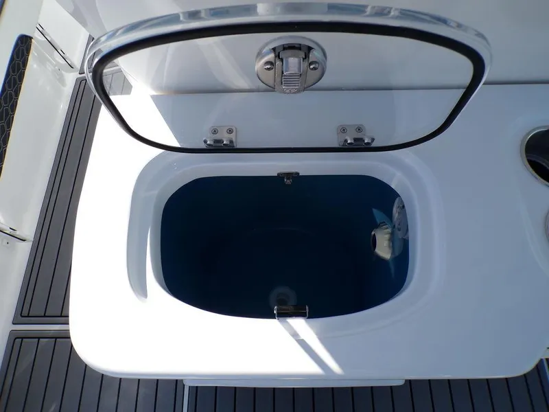 Slide: The Image of Livewell on 2025 Tidewater 2700 CB boat, open lid, sleek design. - 29