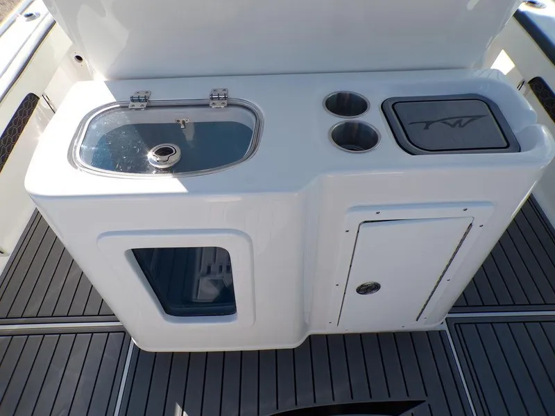 Slide: The Image of Tidewater 2700 CB 2025 boat console with sink and storage compartments. - 30