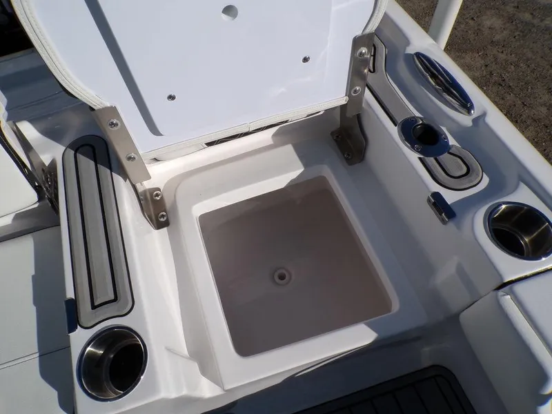 Slide: The Image of 2025 Tidewater 2700 CB boat storage compartment with cup holders and seating. - 33
