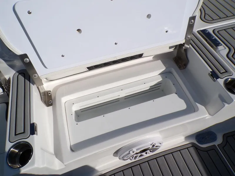 Slide: The Image of Tidewater 2700 CB 2025 boat storage compartment with open lid, showcasing interior details. - 34