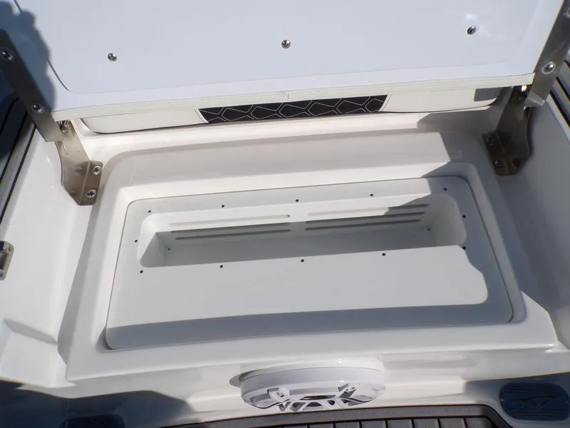 Slide: The Image of 2025 Tidewater 2700 CB boat storage compartment with open lid. - 35