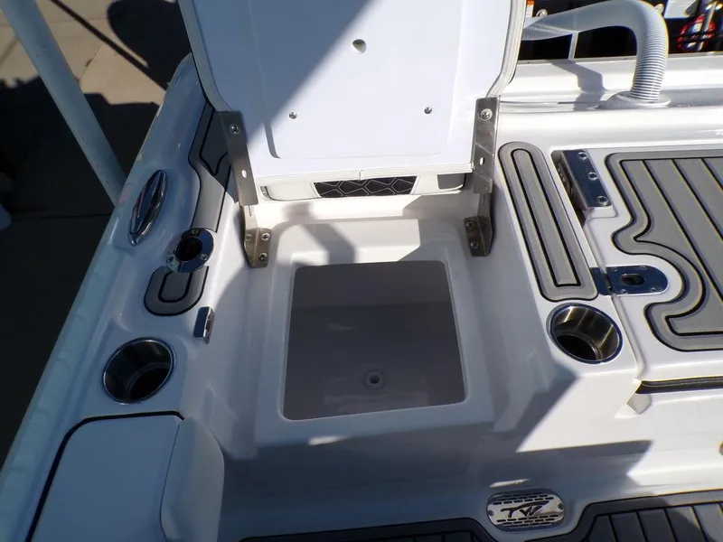 Slide: The Image of Tidewater 2700 CB 2025 boat deck with storage compartment and cup holders. - 37
