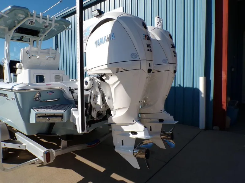 Slide: The Image of 2025 Tidewater 2700 CB boat with dual Yamaha V6 outboard engines. - 5