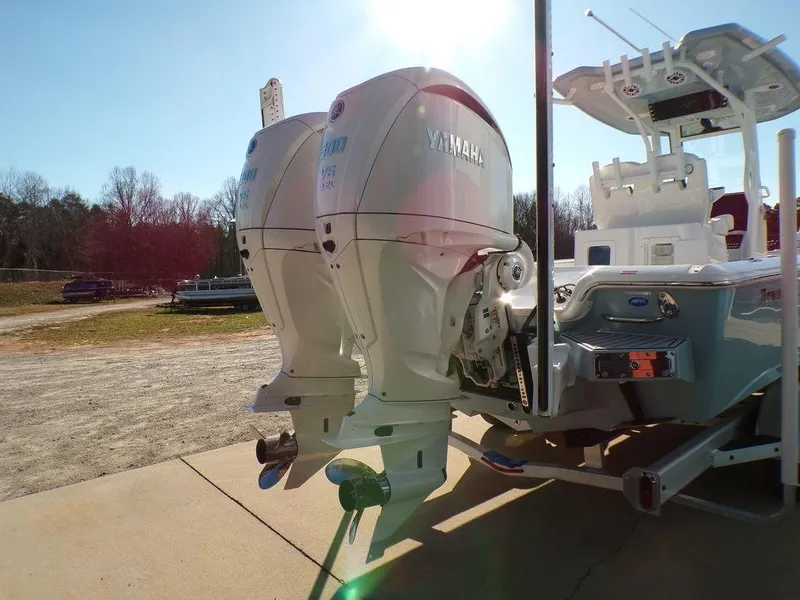 Slide: The Image of 2025 Tidewater 2700 CB boat with dual Yamaha outboard engines in a sunny outdoor setting. - 6