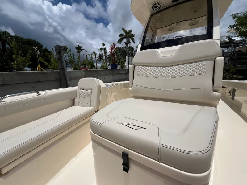 Slide: The Image of 2025 Scout 281 XSS boat interior with luxurious seating and modern design. - 8