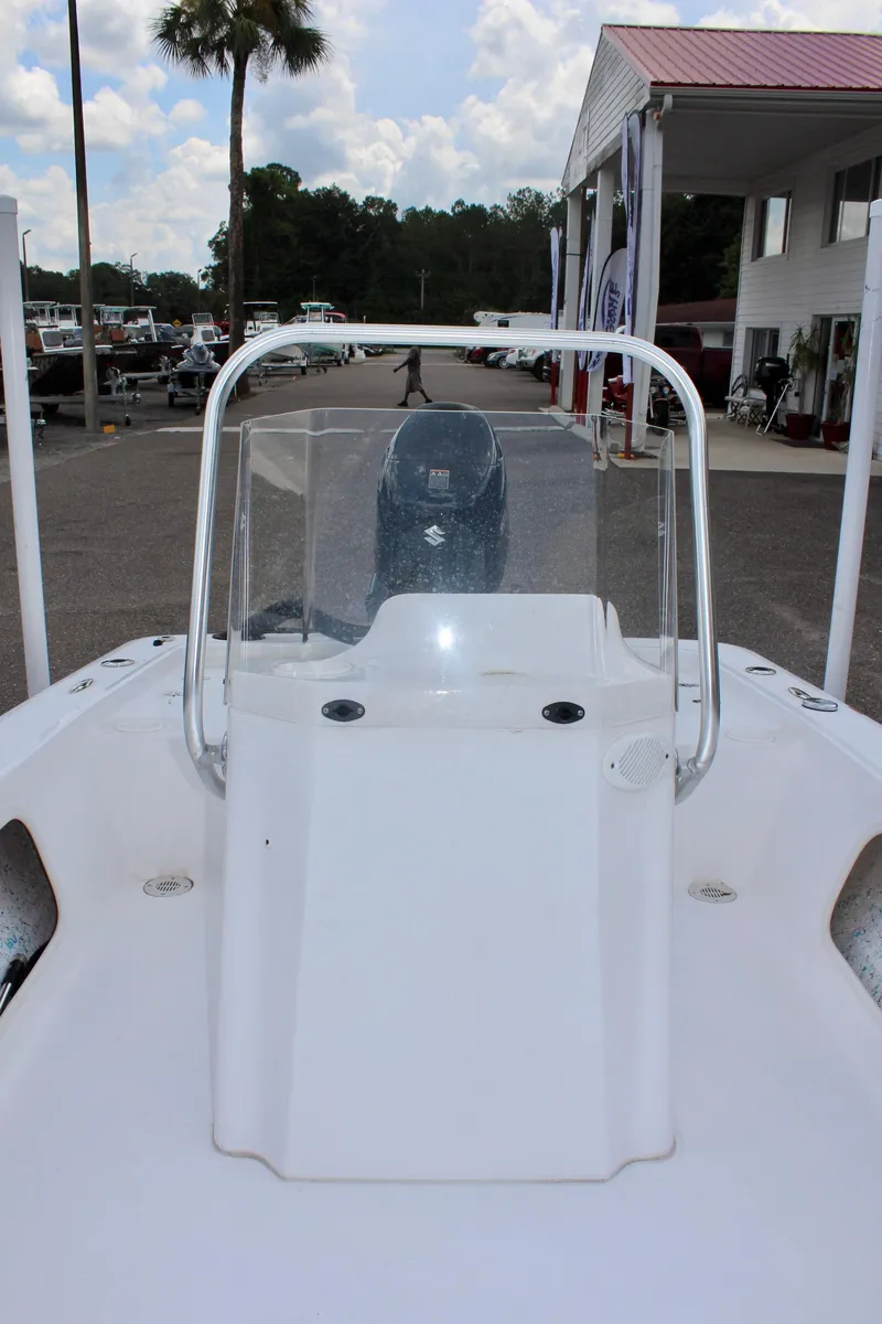 Slide: The Image of 2024 ALK2 Powerboats 17HS with helm console, parked outdoors. - 17