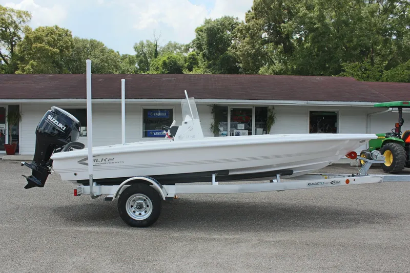 Slide: The Image of 2024 ALK2 Powerboats 17HS on trailer in front of building. - 5