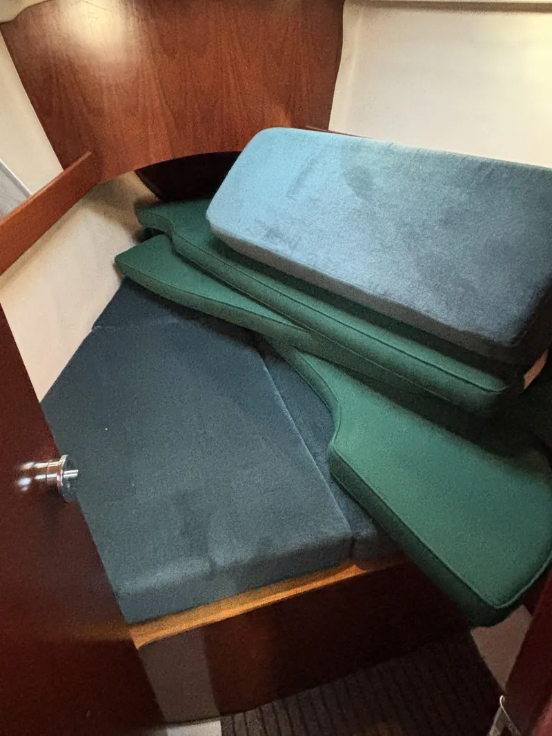 Slide: The Image of Interior cabin of 1997 Beneteau Oceanis 351 sailboat with stacked cushions. - 20