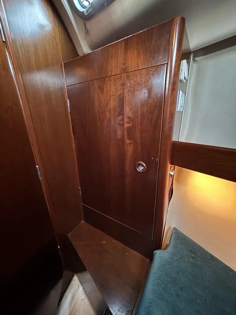 Slide: The Image of Interior cabin of 1997 Beneteau Oceanis 351 sailboat with wooden finish. - 23