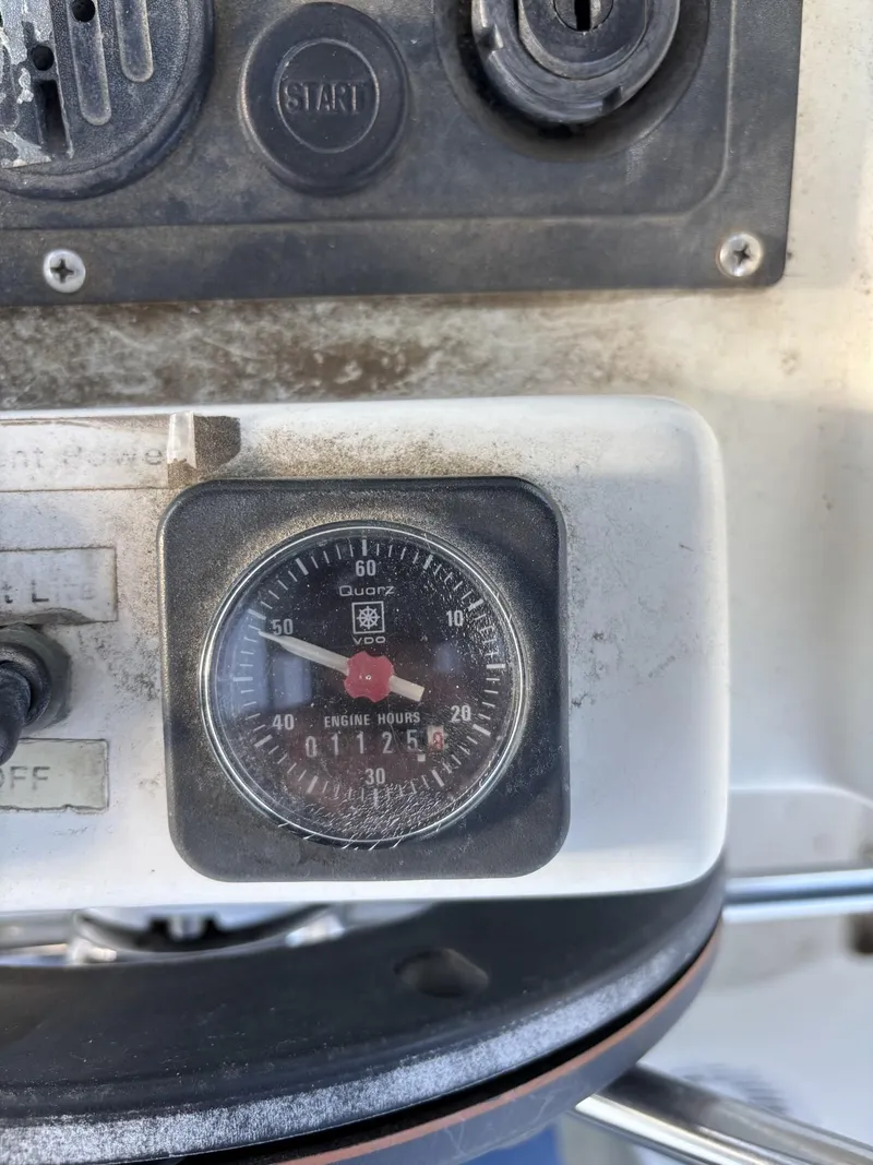 Slide: The Image of Close-up of a 1997 Beneteau Oceanis 351 engine hour meter on a boat dashboard. - 7