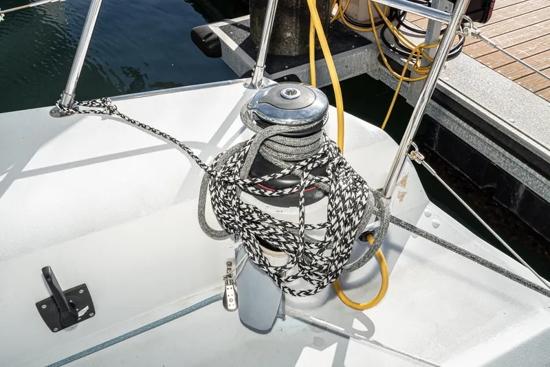 Slide: The Image of Sailboat deck with ropes and winch, Tripp 47, 1992 model, docked at marina. - 11