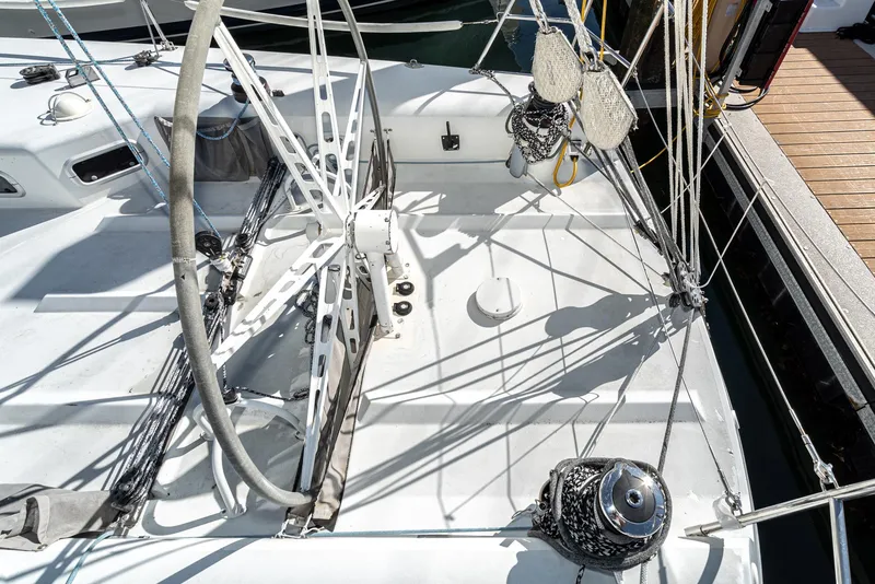 Slide: The Image of Sailboat deck of 1992 Tripp 47, featuring steering wheel and rigging details. - 13