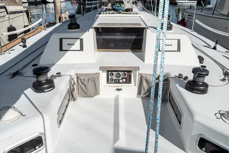 Slide: The Image of Sailboat deck of 1992 Tripp 47, featuring winches and control panel. - 20