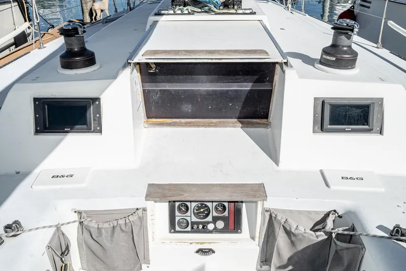 Slide: The Image of Sailboat deck of 1992 Tripp 47, featuring winches and navigation instruments. - 21