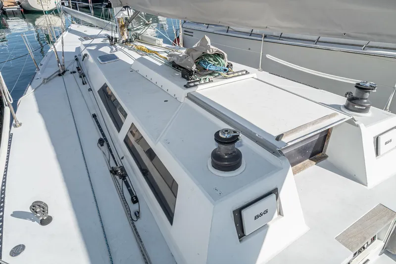 Slide: The Image of Sailboat deck of 1992 Tripp 47, featuring winches and rigging equipment. - 25