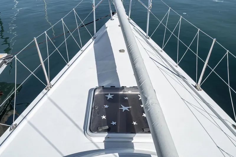 Slide: The Image of Sailboat deck view, Tripp 47 model, 1992, with star-patterned hatch cover. - 29