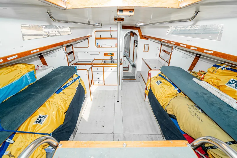 Slide: The Image of Interior of a 1992 Tripp 47 sailboat with bunks and storage. - 33