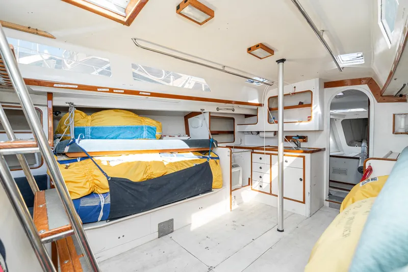Slide: The Image of Interior of 1992 Tripp 47 sailboat with spacious cabin, bed, and storage. - 37