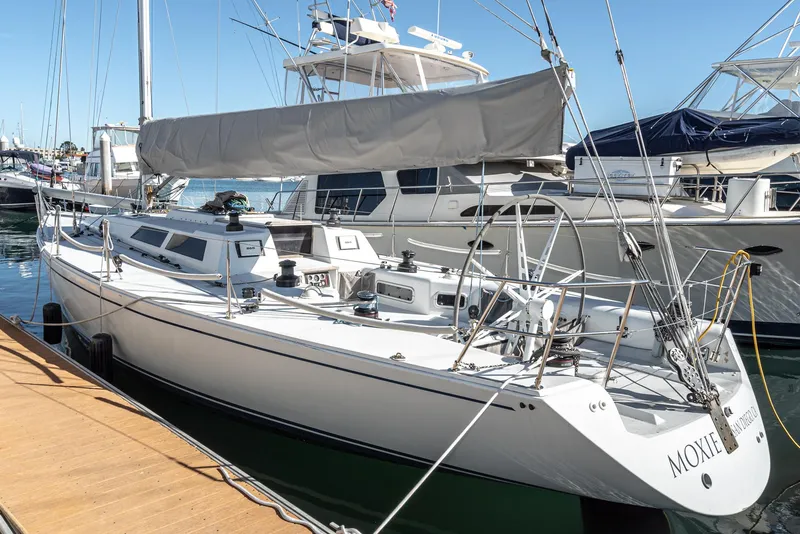 Slide: The Image of Sailboat Tripp 47, 1992 model, docked at marina with other boats. - 6