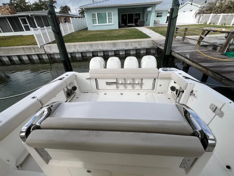 Slide: The Image of 2018 Boston Whaler 420 Outrage boat interior with seating and outboard motors. - 33