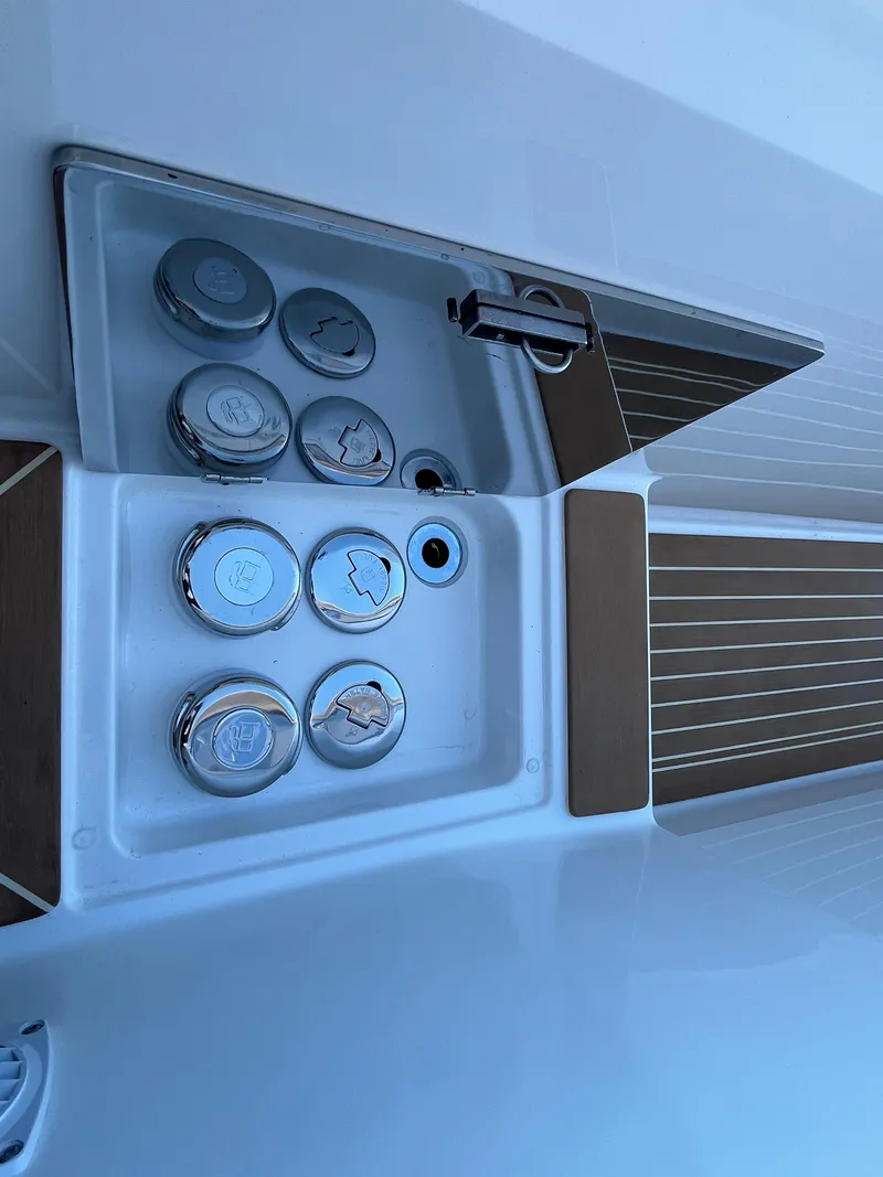 Slide: The Image of Nimbus W11 #46 2025 boat deck with control panel and wooden accents. - 24