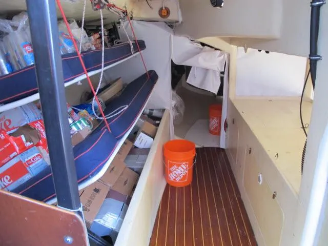 Slide: The Image of Interior of 1985 Santa Cruz 70 sailboat with storage and supplies. - 20