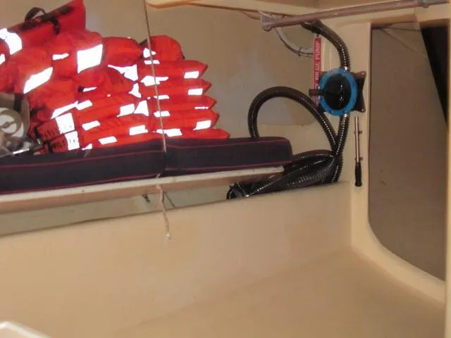 Slide: The Image of Interior of a 1985 Santa Cruz 70 boat with stacked life jackets. - 24