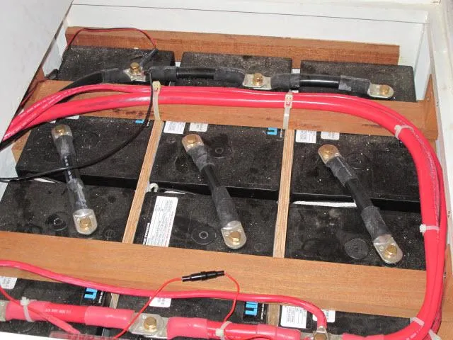 Slide: The Image of Battery compartment with red cables in a 1985 Santa Cruz 70 model. - 30