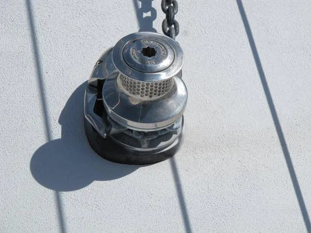 Slide: The Image of Close-up of a winch on a 1985 Santa Cruz 70 sailboat deck. - 45