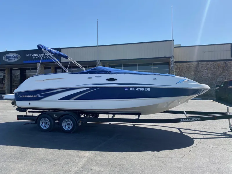 Slide: The Image of 2007 Chaparral Sunesta 252 boat on trailer, parked outside a building. - 3