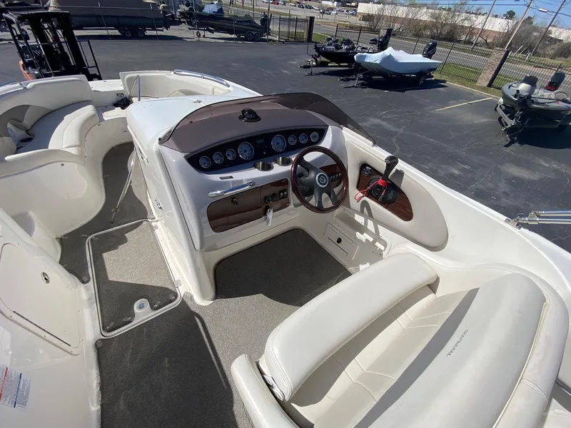 Slide: The Image of 2007 Chaparral Sunesta 252 boat interior with steering wheel and seating area. - 8