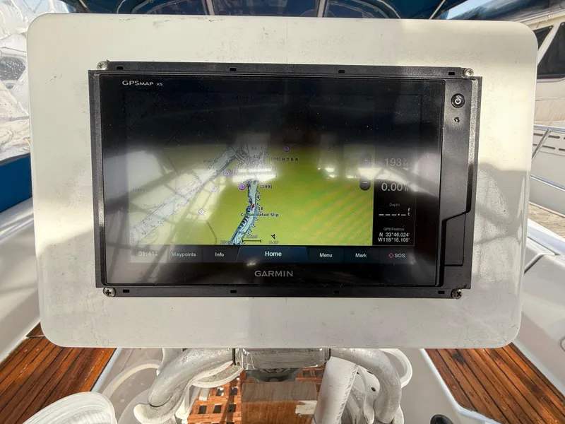 Slide: The Image of Garmin GPS display on 1986 Beneteau Idylle 15.50 sailboat, showing navigation map. - 21