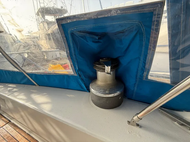 Slide: The Image of Winch on 1986 Beneteau Idylle 15.50 sailboat, covered with blue fabric. - 24